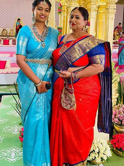 Another shot of this beautiful pair, their coordinated yet distinct sarees showcasing their personal styles.