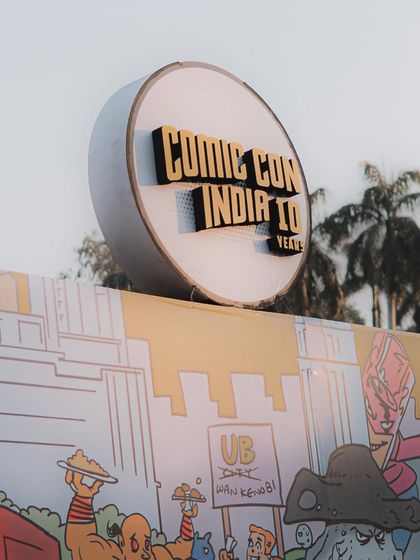 The iconic Comic Con India sign, setting the scene for the festival. This shot establishes the location and the exciting atmosphere of the event.