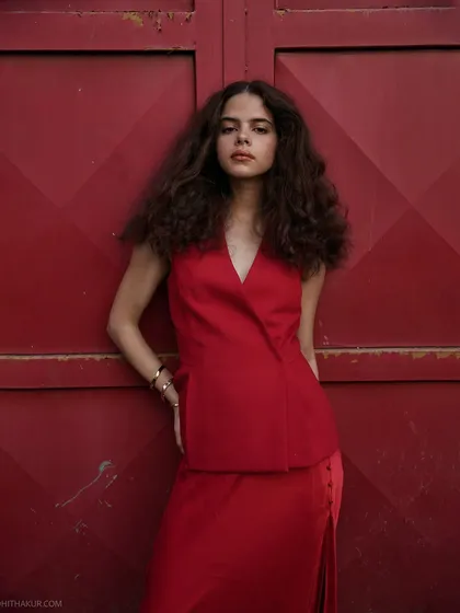 I love finding beauty in everyday cityscapes. The vibrant red of the door provided a perfect, unplanned backdrop for this fashion shoot. This shot shows my ability to direct and capture dynamic, editorial-style images on location, blending bold colour with the model's confident energy.
