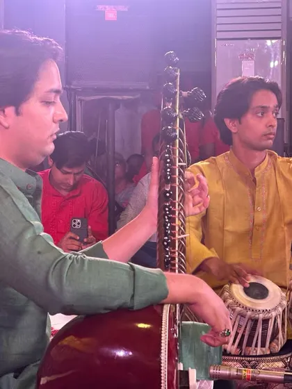 Tuning the sitar during the Sankat Mochan performance. Every detail is important when you are making a musical offering at such a sacred event.