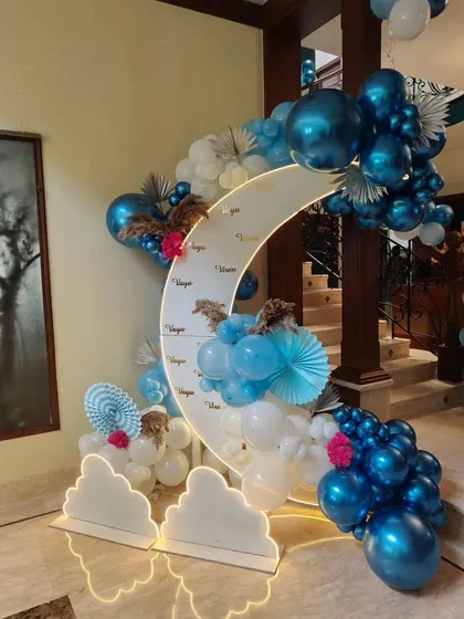 Another angle of the moon-themed welcome decor, showing the intricate balloon work and glowing cloud props.