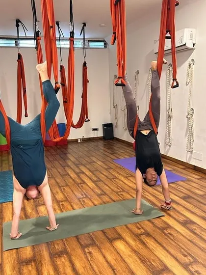 An inversion in an aerial class, part of our Yoga Teacher Training Course. This pose is excellent for spinal decompression and improving blood flow.