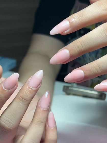 Nude nails give off main character energy. This set of long, almond-shaped nude extensions is simple, elegant, and powerful.