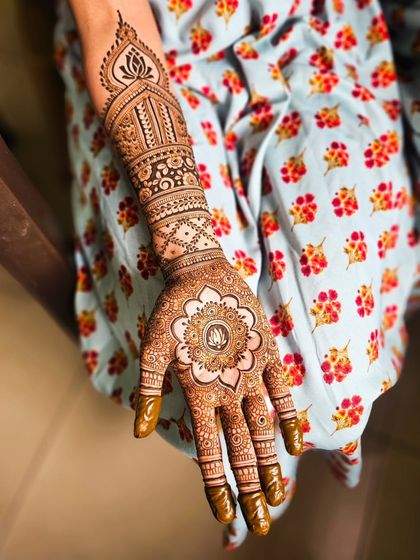 A slightly different angle of the classic bridal mandala design, showing the hidden initials in the center.