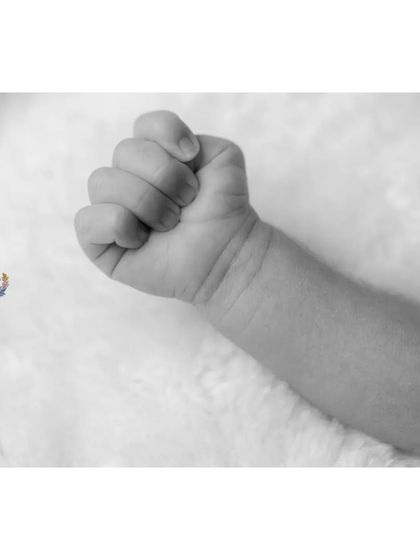 The newborn fist in black and white becomes a study in form and shadow. It's a simple, artistic shot that holds so much meaning.