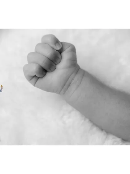 The newborn fist in black and white becomes a study in form and shadow. It's a simple, artistic shot that holds so much meaning.