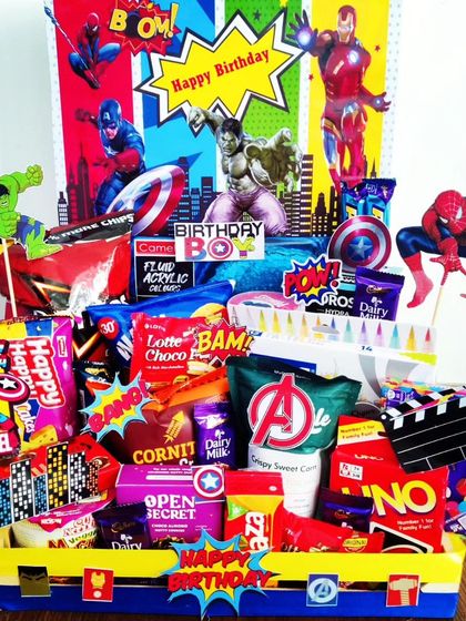 This Avengers-themed birthday hamper is another take on the popular superhero trend. It's loaded with snacks, games like UNO, and dynamic cutouts of Iron Man, Hulk, and Spider-Man for an epic celebration.