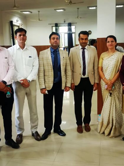 A group photo with fellow advocates at a formal event.