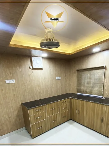 A compact yet fully functional kitchen built inside one of our portable units. It features ample cabinet space, a durable countertop, and modern fixtures, providing all the essentials for daily living or office pantry needs.