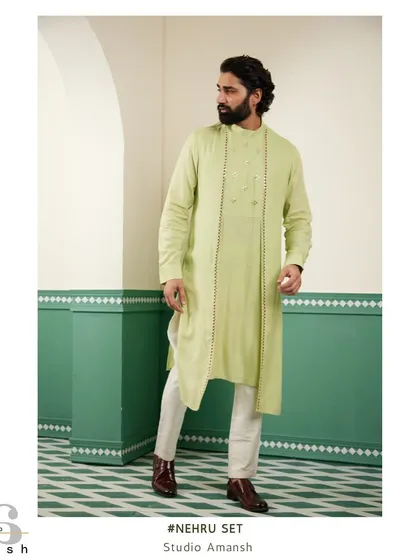 The light green drape kurta shown on its own, highlighting its asymmetric hem and subtle detailing before layering.