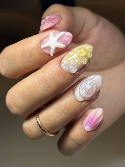 A close-up of the 3D starfish and shell elements from our ocean-themed nail art set, highlighting the incredible detail and artistry.