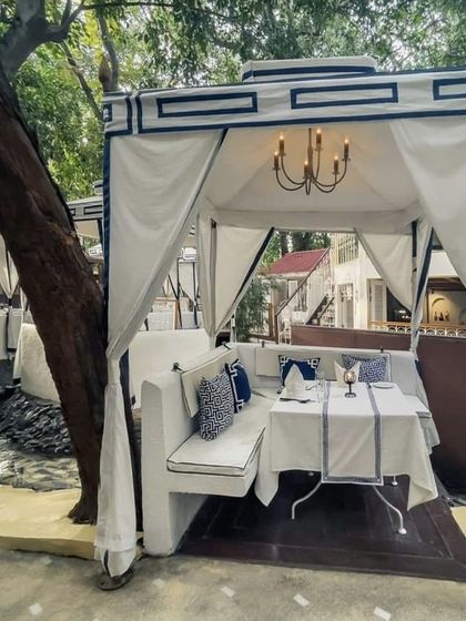 A daytime view of our cabana, showing the crisp white and blue decor that gives it a fresh, Mediterranean feel.