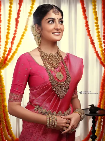 A full look from the Rajakumari Gold campaign. The makeup was designed to be bold enough to balance the heavy, antique-finish temple jewelry while still looking elegant and beautiful.