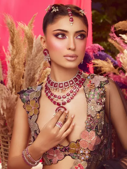 The full look in all its glory. The vibrant makeup is a perfect match for the colorful floral lehenga by Aisha Rao.