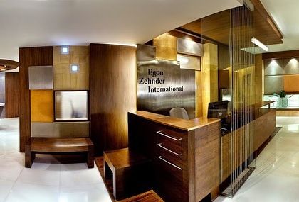 The reception desk at the Egon Zehnder office combined warm wood with panels of metal and leather. The design was meant to feel established and sophisticated, reflecting the nature of the firm.
