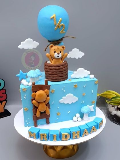 A teddy bear hot air balloon themed half-birthday cake. This is one of our most popular designs for the six-month mark.