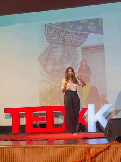 On the TEDx stage, with a projection of one of my artworks behind me. In my talk, I shared how my travels and the people I meet inspire the stories I tell on canvas and on walls.