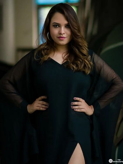 A powerful, direct portrait from the same series. The framing puts the focus entirely on the model's confident expression and stance.