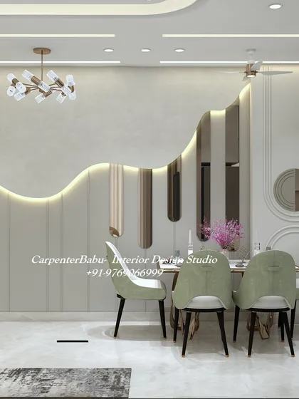 This dining area features a stunning feature wall with an organic, wave-like design and integrated backlighting. The soft green chairs add a subtle touch of color to the neutral space.