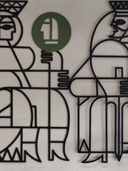 A detail shot showing the Queen and King figures from the 'Queen's Gambit' piece.