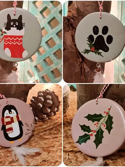 For the animal lovers at Christmas. Our ornament collection includes a cat in a stocking, a festive paw print, a penguin, and classic holly leaves.