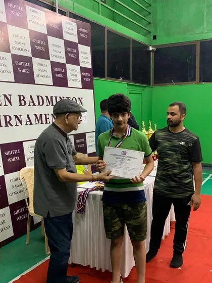 A student receiving his certificate and medal at a local tournament. I encourage all my players to participate in competitions to gain valuable match experience.