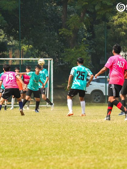 A header attempt during a corner kick, a moment of high drama in the GSC vs Manav Rachna match.