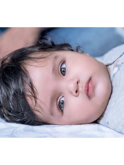 A quiet, contemplative moment with Anika. Even during a playful sitter session, I look for these serene moments that show a different side of your baby's personality.