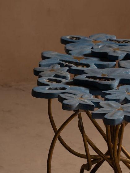 This side view of the Gul Table showcases the dynamic arrangement of the flowers and stems. It's a piece that looks different from every angle, constantly revealing new details and complexities.