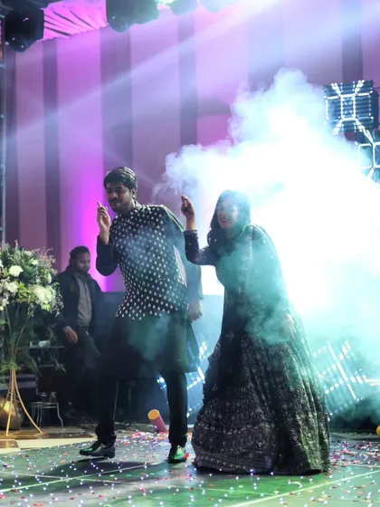 A snapshot of a couple lost in the music on their sangeet night. We focus on creating moments where you can just enjoy the dance and each other.