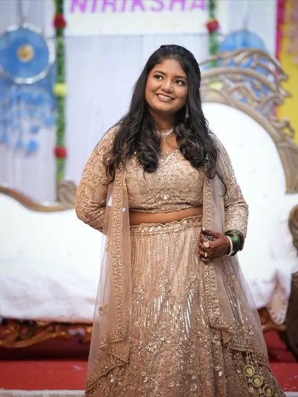 A close-up view of the beige engagement lehenga. You can see the detailed sequin work on the blouse and the simple, elegant necklace she chose from my collection.