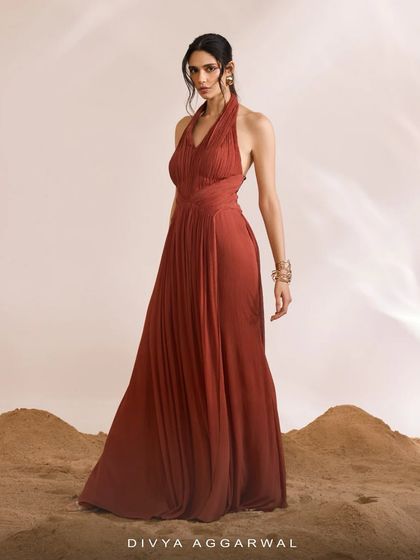 The Luna Dress, orchestrated for modern celebrations. Its expertly gathered fabric and flowing form evoke a sense of effortless grace and style.