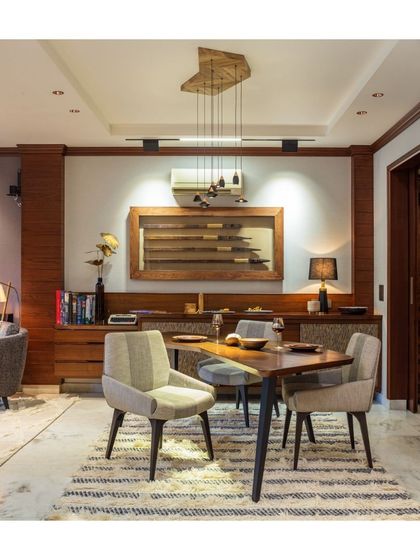 This elegant buffet counter at our Treetops project offers the perfect blend of function and aesthetics. Behind its sleek sliding shutters lies ample storage for dining essentials, keeping the space organized while adding a sophisticated touch to the dining area.