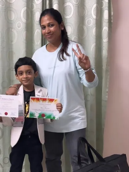 Aden poses with his teacher and his well-earned certificates. This picture captures the supportive relationship between our teachers and students that leads to such wonderful achievements.
