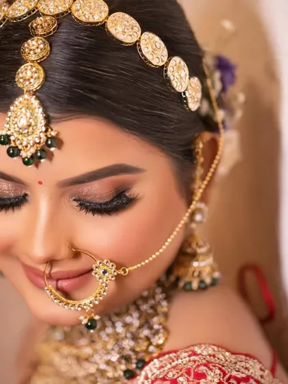 A closer look at the eyes tells a story. For this bride, we created a soft yet defined eye makeup look with a clean wing and subtle shimmer that beautifully complements her traditional gold jewelry. It’s all in the details.