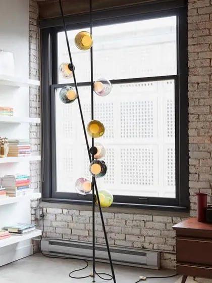 The Bocci 28 series reimagined as a floor-to-ceiling column. This innovative spike system allows for vertical installations in corners or against walls, creating a totem of light.