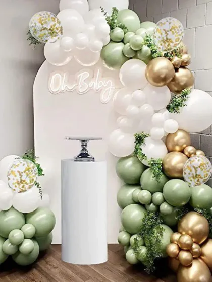 An elegant and modern 'Oh Baby' shower backdrop. I used a beautiful combination of sage green, white, and chrome gold balloons with a custom arched panel and a white plinth stand for the cake.