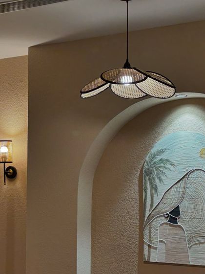 A wider view of the art installation at Seezen. The custom shape and theme of the artwork complement the cafe's relaxed, bohemian vibe.