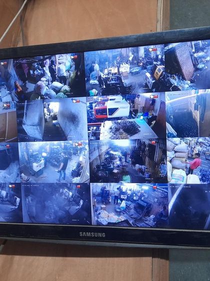 A 16-camera view of a crowded warehouse or market, demonstrating our capability for large-scale commercial projects.