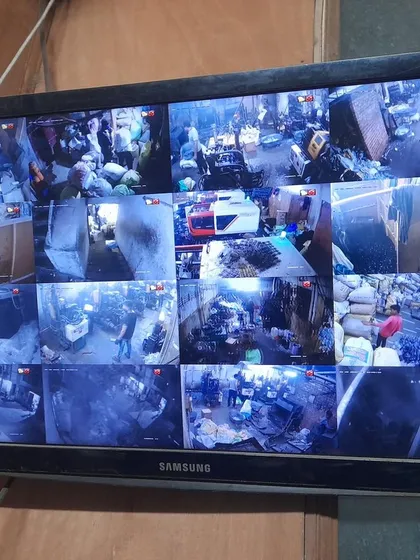 A 16-camera view of a crowded warehouse or market, demonstrating our capability for large-scale commercial projects.