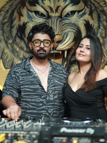 Posing with a fan at the DJ booth.