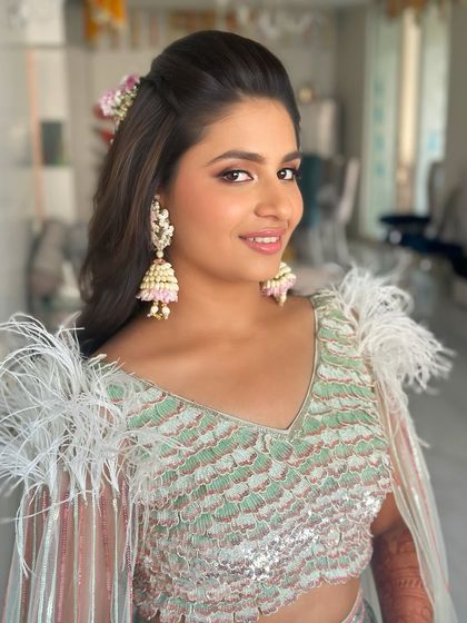 A close-up of the glamorous Mehendi makeup, showing the soft smokey eye and glossy pink lip that keeps the look effortlessly chic.