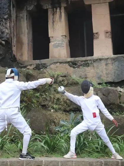 A practice bout in progress, with one fencer initiating an attack. Training in different environments helps our athletes become more adaptable.