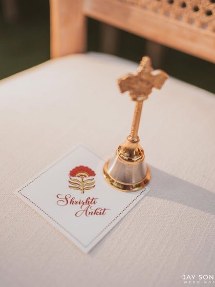 It’s the intricate details that make a celebration unforgettable. This custom wedding favor, a small bell with the couple's names, was a beautiful touch for the ruby-themed affair.