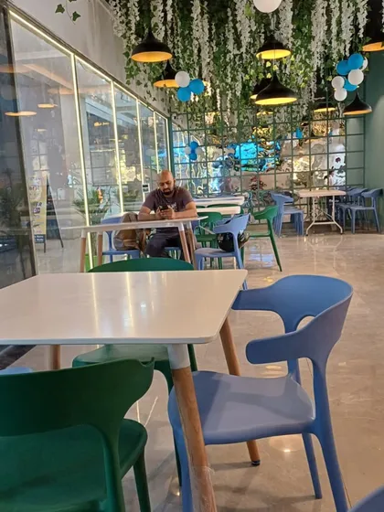 Even when it's quiet, the space feels warm and ready to welcome guests, with its clean tables and pleasant decor.