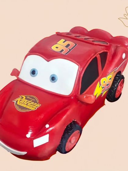 A 3D Lightning McQueen cake, sculpted to look just like the famous race car. This impressive creation is a guaranteed showstopper at any birthday party.