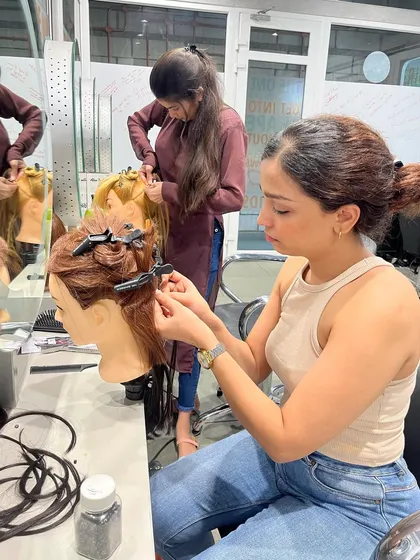 Learning to work with different types of hair extensions is part of our comprehensive curriculum.