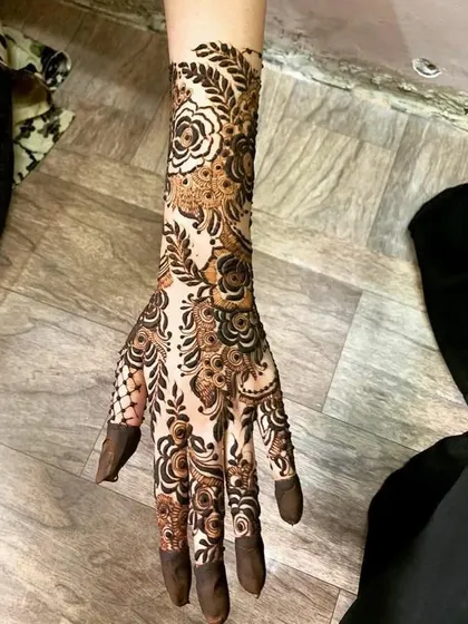 A full-arm floral design that is both bold and elegant. The use of negative space makes the rose patterns truly stand out.