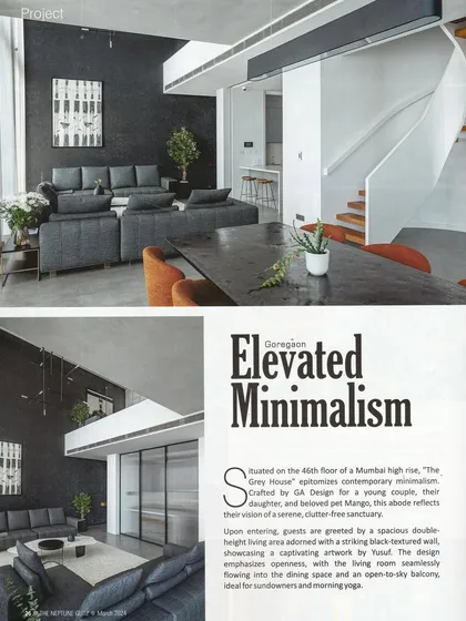 A magazine feature detailing the 'Elevated Minimalism' of 'The Grey House', highlighting the double-height living room and the striking black textured wall.