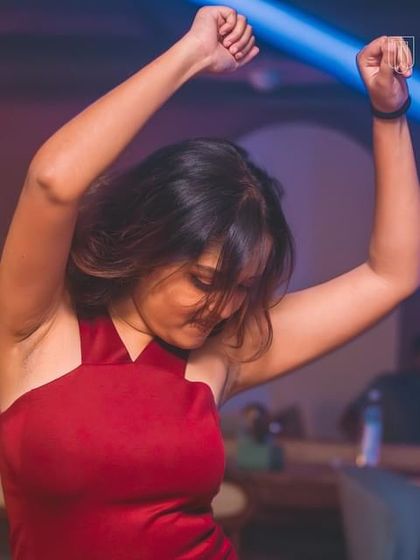 A guest lost in the moment on the dance floor.